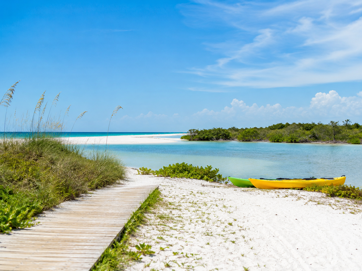 Quiet Siesta Key shoreline with kayaks